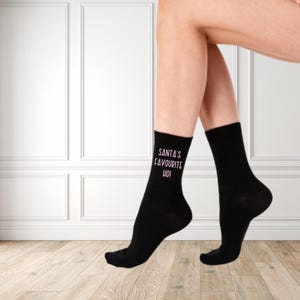Santa’s Favourite Ho Socks – Funny Christmas Socks | Cheeky Holiday Gag Gift | Black Novelty Socks with Bold Print