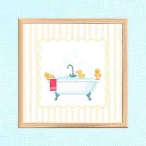 May include: A framed print featuring a white bathtub with blue accents, filled with bubbles and three yellow rubber ducks. A red towel hangs on the side. The background has a striped pattern and a light blue border.