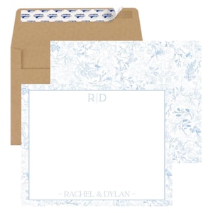 May include: A stationery set with a blue floral pattern. The set includes a blank card with a light blue border, the initials "RD", and the names "RACHEL & DYLAN". A matching envelope is included.