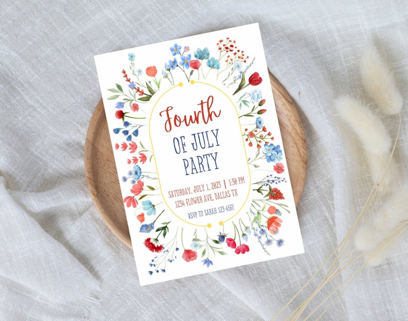 May include: A white invitation card with a floral border in shades of red, blue, and green. The text reads "Fourth of July Party" with the date, time, and location below.