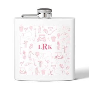 May include: White flask with a silver cap and hinge. The flask features a pink golf-themed pattern with golf carts, clubs, and balls. The initials "LRK" are printed in pink on the front.