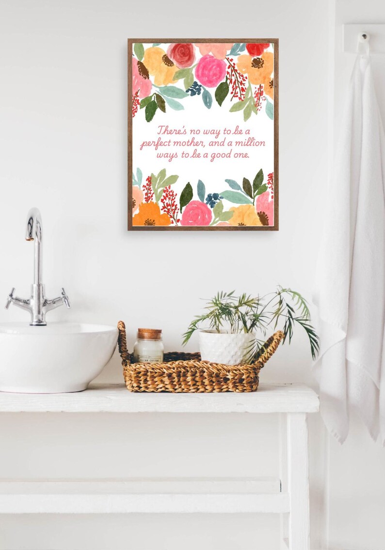 May include: A framed print with a floral design and a quote that reads "There's no way to be a perfect mother, and a million ways to be a good one."