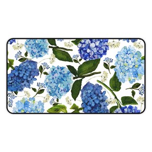 May include: A white background with a repeating pattern of blue hydrangea flowers and green leaves.