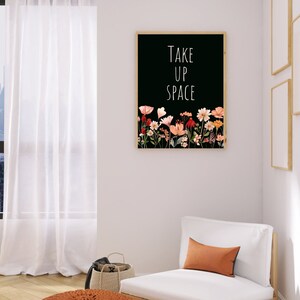 May include: A black and white printable art print with the text "Take Up Space" and a floral design in shades of pink, orange, and red.