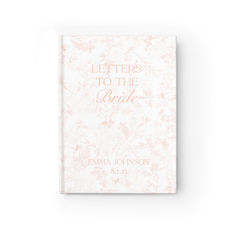 May include: A white journal with a floral pattern and the text "Letters to the Bride" in a delicate script. The journal also includes the name "Emma Johnson" and the date "8.7.25". The cover has a soft, romantic aesthetic.