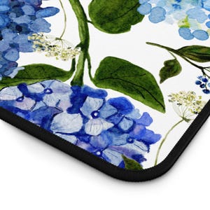 May include: A watercolor illustration of blue hydrangeas with green leaves on a white background. The flowers are arranged in a repeating pattern.