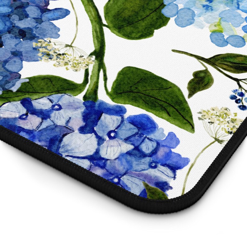 May include: A watercolor illustration of blue hydrangeas with green leaves on a white background. The flowers are arranged in a repeating pattern.