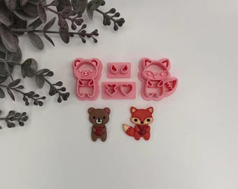 Fox or bear holding heart cutter for making polymer clay earrings, handmade jewelry tools