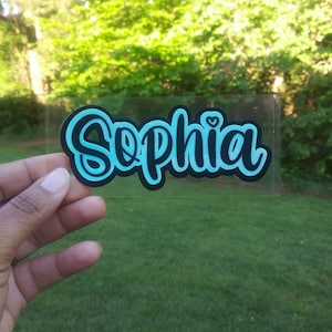 One custom vinyl name or word decal sticker in three colors and that is measured by width (first letter to last letter); not height. 

** THREE COLORS Sticker ~ Use Dropdown box for first color & Personalization Box for second and third colors.