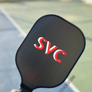 Custom paddle craftsmanship for discerning players Bespoke pickleball gift for a memorable occasion Unique paddle style that stands out on the court Pickleball player's present with customized features