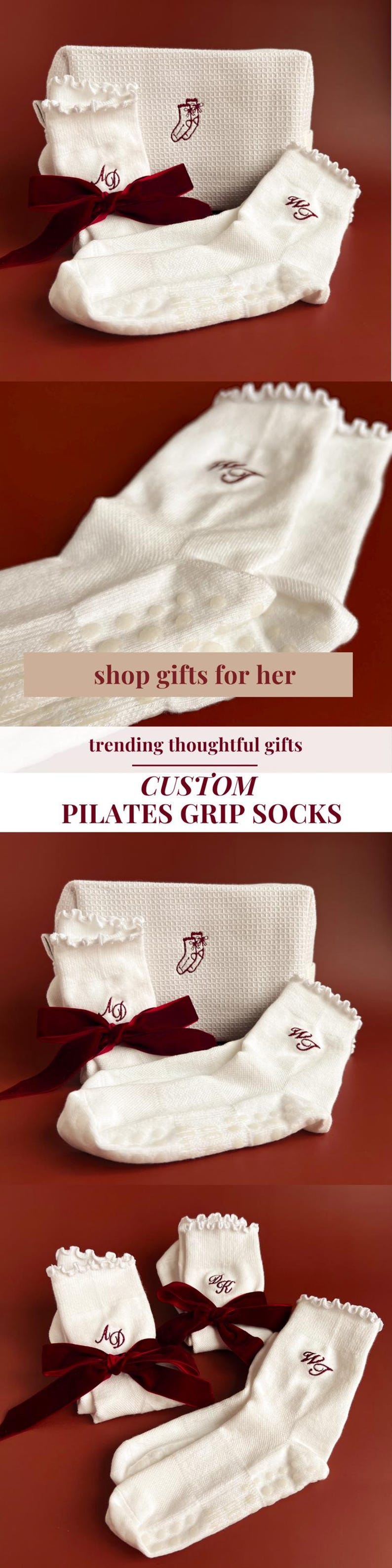 May include: White custom Pilates grip socks with a burgundy bow and monogram. The socks have a ruffled edge and a non-slip grip. A matching white waffle-weave towel is also in the image. Text on the image says "shop gifts for her".