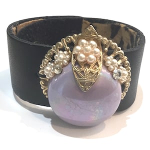 Black leather cuff bracelet adorned with Vintage jewelry piece, “up cycled “, repurposed costume jewelry