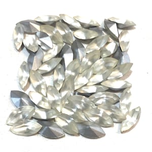 Vintage Swarovski 10 x 5 rhinestones. Satine color. Silver foiled pointed back. 50 count.
