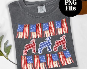May include: Dark gray t-shirt with a patriotic design. The shirt features a garland of American flags and three sheep in red, white, and blue patterns. The text "PNG File" is in a black circle.