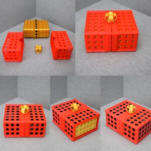 Op de afbeelding: Een rode en zwarte cadeaudoos met een gouden strik. De doos is gemaakt van plastic en heeft een rasterpatroon aan de zijkanten. De doos is open en de binnenkant is zichtbaar. De binnenkant van de doos is goud.