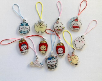 May include: A collection of ten colorful keychains featuring cartoon animal characters. The keychains are made of clear acrylic and have different colored strings.