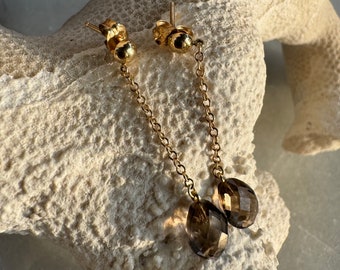 May include: A pair of gold chain earrings with smoky quartz teardrop pendants.