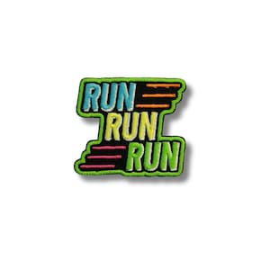 May include: Embroidered patch with the word "RUN" stacked three times in a stylized design. The patch features a green border, with the word "RUN" in blue, yellow, and green. Orange and pink horizontal lines are also present.