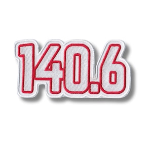 May include: White embroidered patch with red outline, featuring the number "140.6".