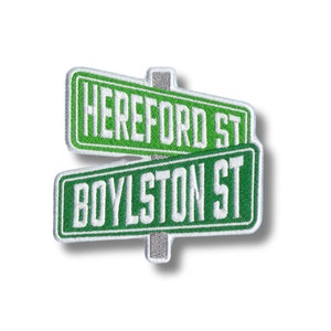 May include: Green and white embroidered patch with the text "HEREFORD ST" and "BOYLSTON ST" on two intersecting street signs.