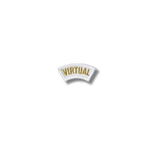 May include: A white, curved patch with gold embroidered text that reads "VIRTUAL". The patch has a slight curve and a clean, minimalist design, suitable for sewing or ironing onto fabric.