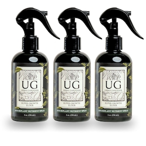 May include: Three 8-ounce bottles of Urban Gardener Super Growth Elixir houseplant nutrient spray. The bottles are black with a white label and green accents. The label reads "UG Urban Gardener Super Growth Elixir Houseplant Nutrient Spray 8 oz. (236 ml.)"