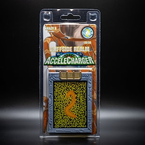 May include: A packaged collectible card labeled "Cliffside Realm Accelecharger" with a maze-like design and the text "Krazy 8 Customs." The card is in a clear plastic case against a black background.