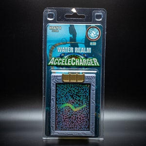 May include: A packaged "Water Realm Accelecharger" collectible. The card is in a clear plastic case. The card has a gray border with a gold accent. The card's center has a colorful, abstract design. The packaging reads "Krazy 8 Customs".