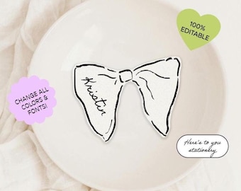 May include: A black and white printable bow tie place card with the name "Kristin" written on it. The place card is on a white plate. The text "100% Editable" and "Here's to you stationery" is also visible in the image.