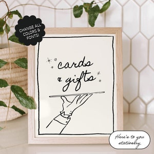 Może przedstawiać: Czarno-biała ilustracja dłoni trzymającej tacę z tekstem "cards & gifts" nad nią. Tekst "Here's to you stationery" znajduje się pod ilustracją.