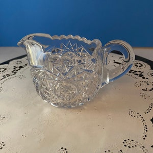 vintage cut crystal creamer. 3” tall and 3” wide.