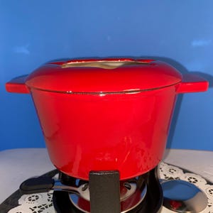 Artisanal 1.2 qt enameled cast iron fondue 13 piece set.