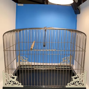 vintage 1950’s birdcage. the cage is 12 1/2” tall and 14 1/2” long. and it is 9 1/2” wide. it has metal wire.