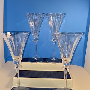 Set of 4  Mikasa 9”tall crystal wine glasses.  First Love pattern. No chips or cracks. Beautiful glasses!