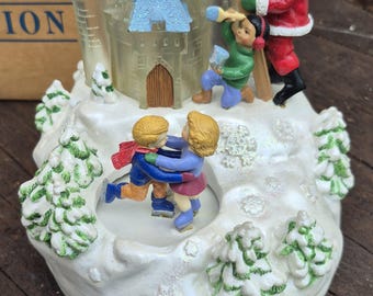This is a 1997 Avon Gift Collection "Santa's Magical Castle" musical music box
