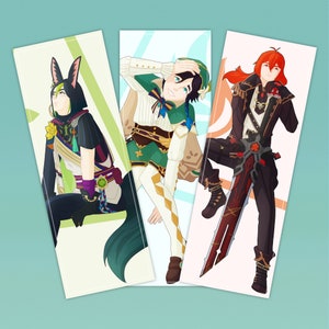 May include: Three illustrated bookmarks featuring anime-style characters. The first bookmark features a character with green hair and a green and white outfit. The second bookmark features a character with red hair and a black and white outfit. The third bookmark features a character with blue hair and a black and white outfit.