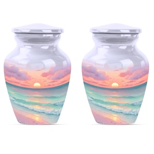 Keepsake urns set featuring miniature ocean urns with beach scene and glowing sunset design.