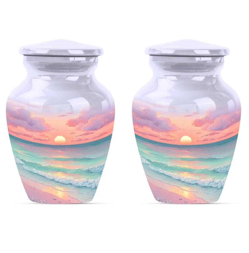 Keepsake urns set featuring miniature ocean urns with beach scene and glowing sunset design.