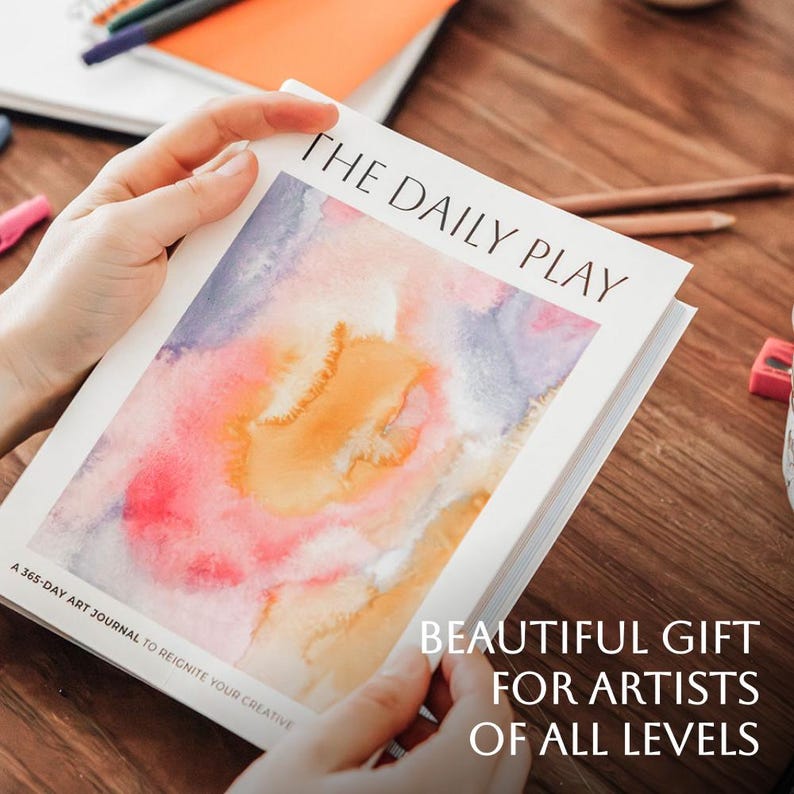 A person is holding the Daily Play in their hands and the text reads " A Beautiful gift for artists of all levels"