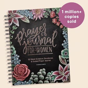 May include: A spiral-bound prayer journal with a black cover featuring colorful floral illustrations. The text reads Prayer Journal FOR WOMEN, 52 Week Scripture, Devotional, & Guided Prayer Journal, and Shannon Roberts. A purple circle says 1 million+ copies sold.