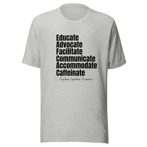 Puede incluir: Una camiseta gris jaspeada con texto negro que dice "Educate, Advocate, Facilitate, Communicate, Accommodate, Caffeinate" y "Angelman Syndrome Awareness".