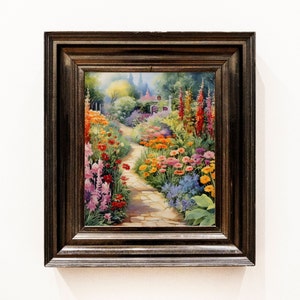 May include: A framed painting of a garden path lined with colorful flowers. The path leads to a small cottage in the distance. The painting is in a dark brown frame.
