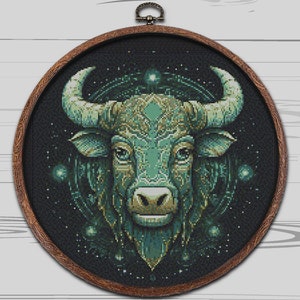 May include: A green and black bull's head with intricate details, surrounded by a starry night sky. The bull's head is a symbol of strength and power.