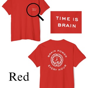 May include: Red t-shirt with the text "TIME IS BRAIN" on the front and a white graphic of a brain with a clock inside and the text "BRAIN POWER EVERY HOUR" on the back.