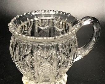 Small Glass Cup with Fancy Pattern