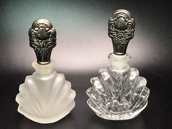 Two empty perfume bottles