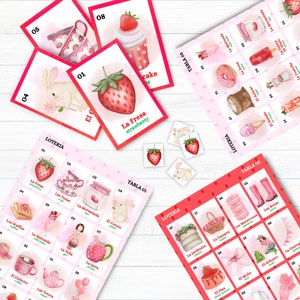 May include: A pink and red bingo game set with a strawberry theme. The set includes a game board with images of strawberries, cakes, and other treats, as well as a set of cards with matching images. The game is called "La Fresa" which means "The Strawberry" in Spanish.