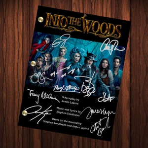 May include: A black and gold script font title card for the movie "Into the Woods" with the signatures of the cast and crew. The signatures include Meryl Streep, James Lapine, Stephen Sondheim, Chris Pine, and others.