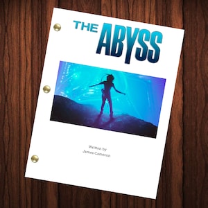 May include: A white script cover for the movie "The Abyss" with a blue and purple image of a diver in a dark silhouette standing on a rock in a blue and purple underwater scene. The text "Written by James Cameron" is at the bottom of the page.