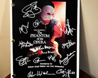 May include: A black and white signed script from the movie "The Phantom of the Opera" featuring the title of the movie, the names of the screenwriter and director, and the signatures of the cast and crew.